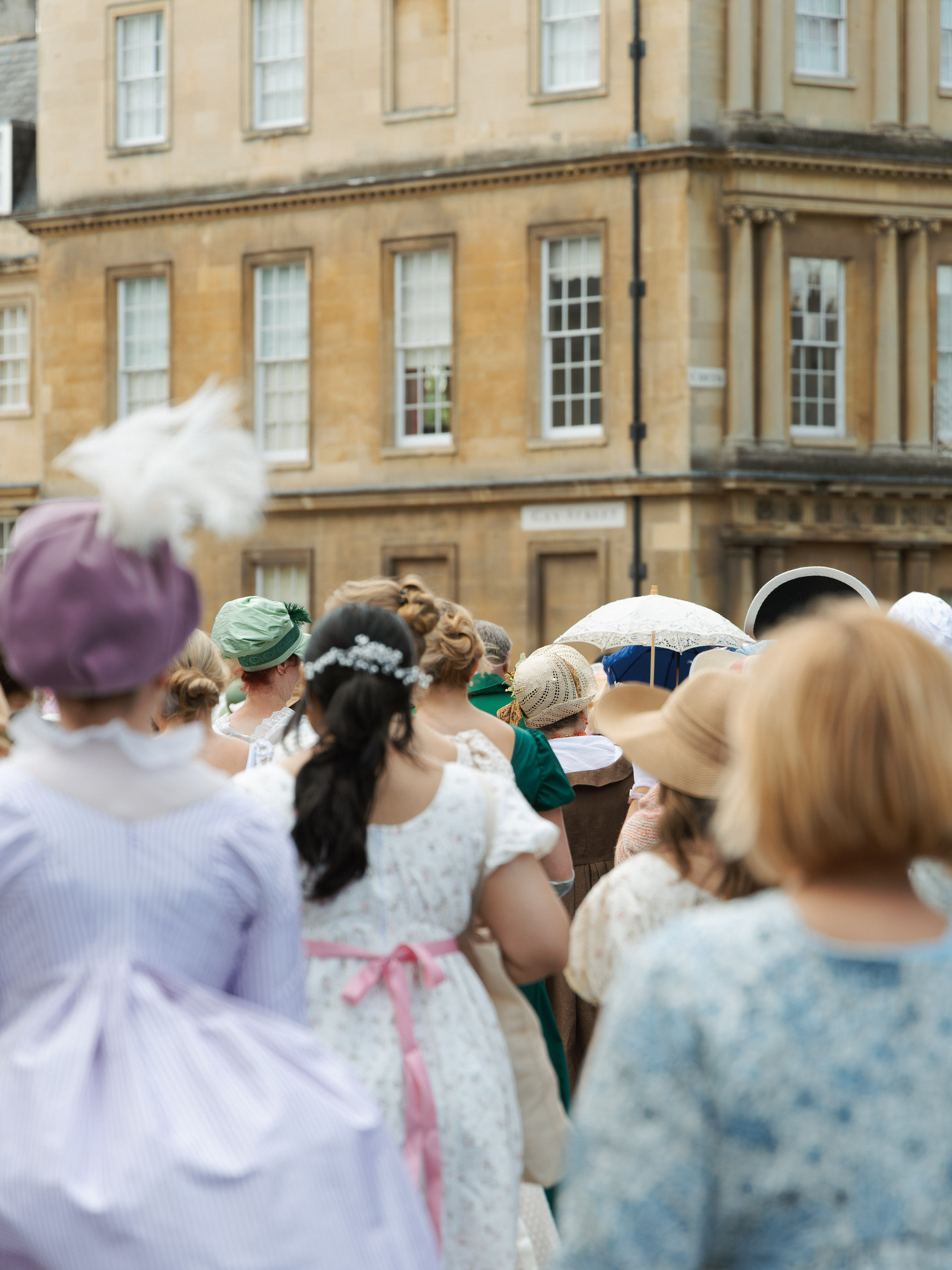 Crowd in Regency costume walking through Georgian Bath during the Jane Austen Festival